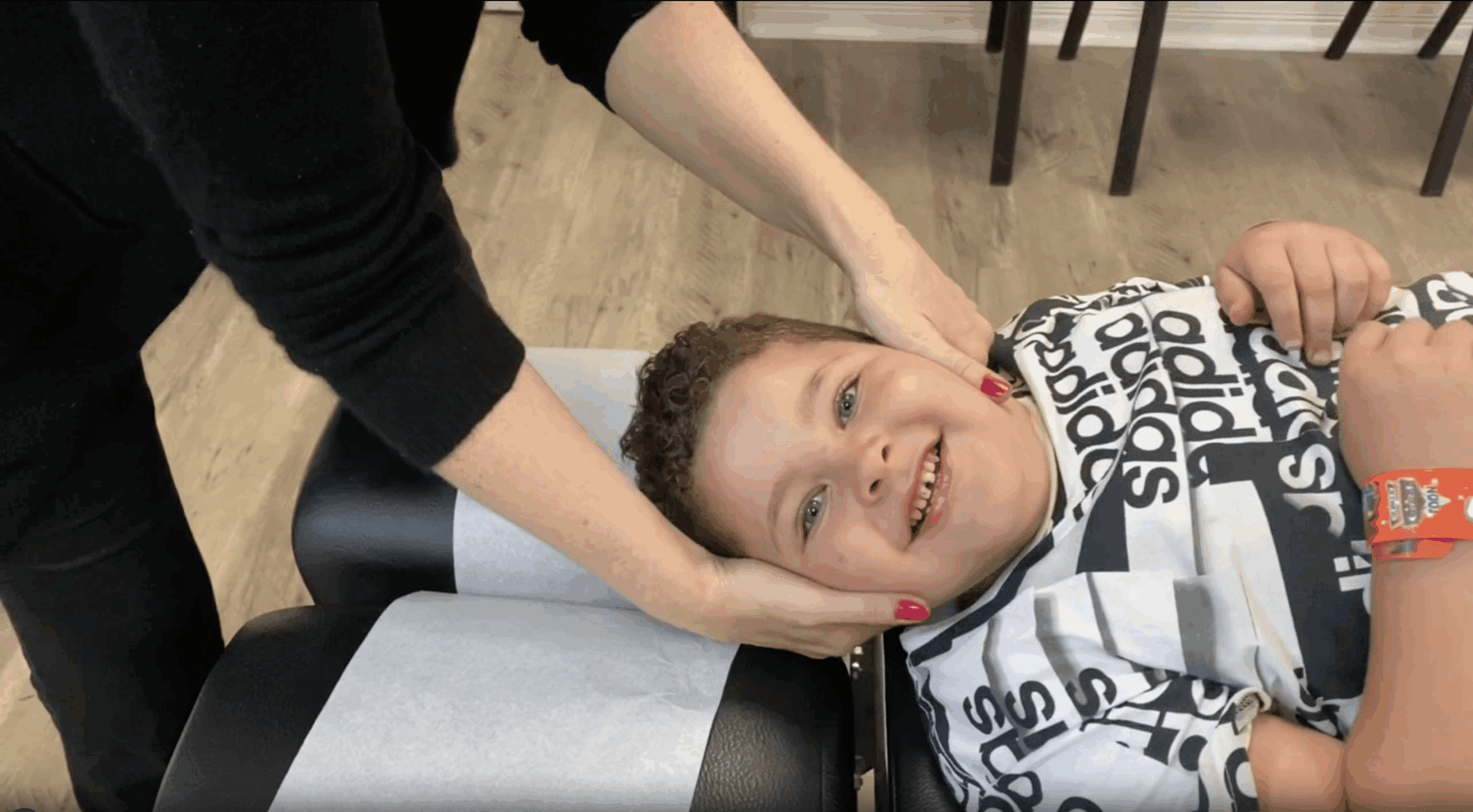 Chiropractor providing gentle adjustment for child in Elmwood Park, IL